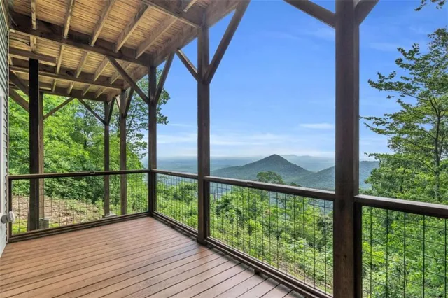 a view of a balcony with wooden floor
