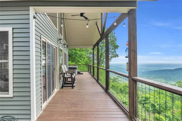 a view of a porch with wooden floor and outdoor space