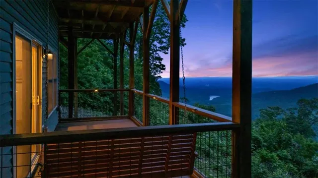 a backyard of a house with lots of green space and mountain view