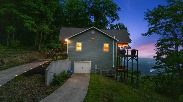 a backyard of a house with lots of green space and mountain view