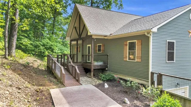 a view of a backyard with wooden fence