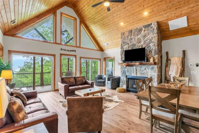 a living room with furniture fireplace and a flat screen tv