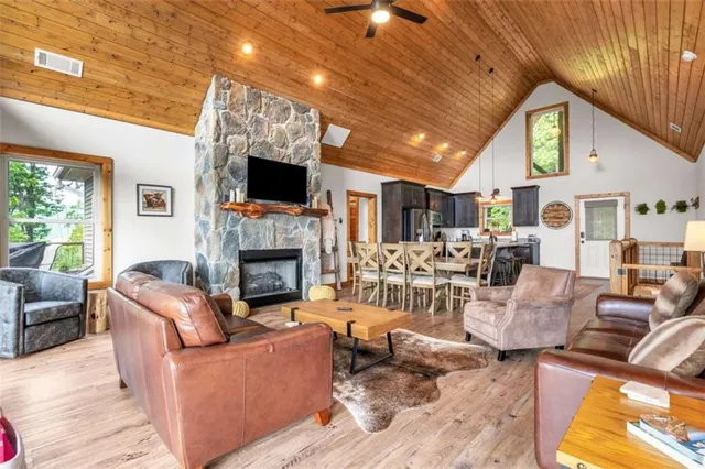 a living room with stainless steel appliances kitchen island granite countertop furniture and a kitchen view