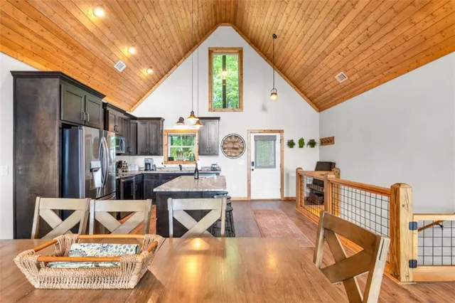 a kitchen with stainless steel appliances granite countertop a sink and cabinets