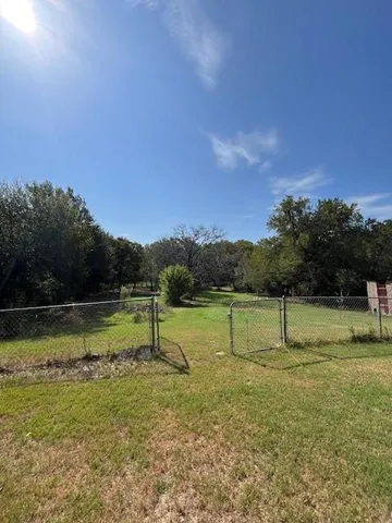 a view of outdoor space with deck and yard