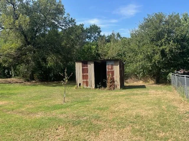 a backyard of a house with lots of green space
