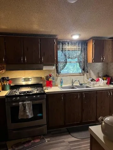 a kitchen with a stove and a sink