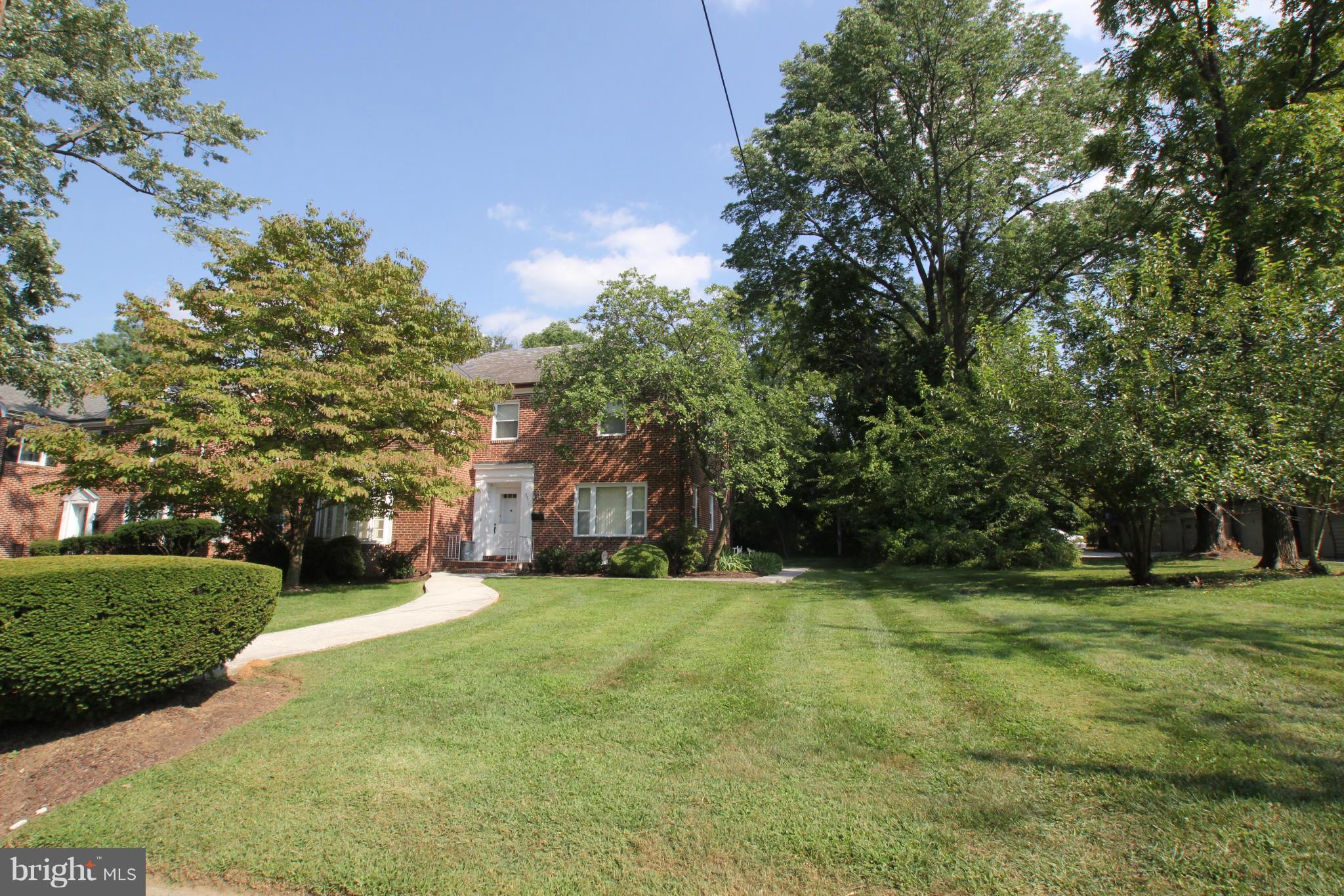 3511 Labyrinth Road Baltimore, MD 21215 - Photo 1 of 20 a view of a big yard with large trees