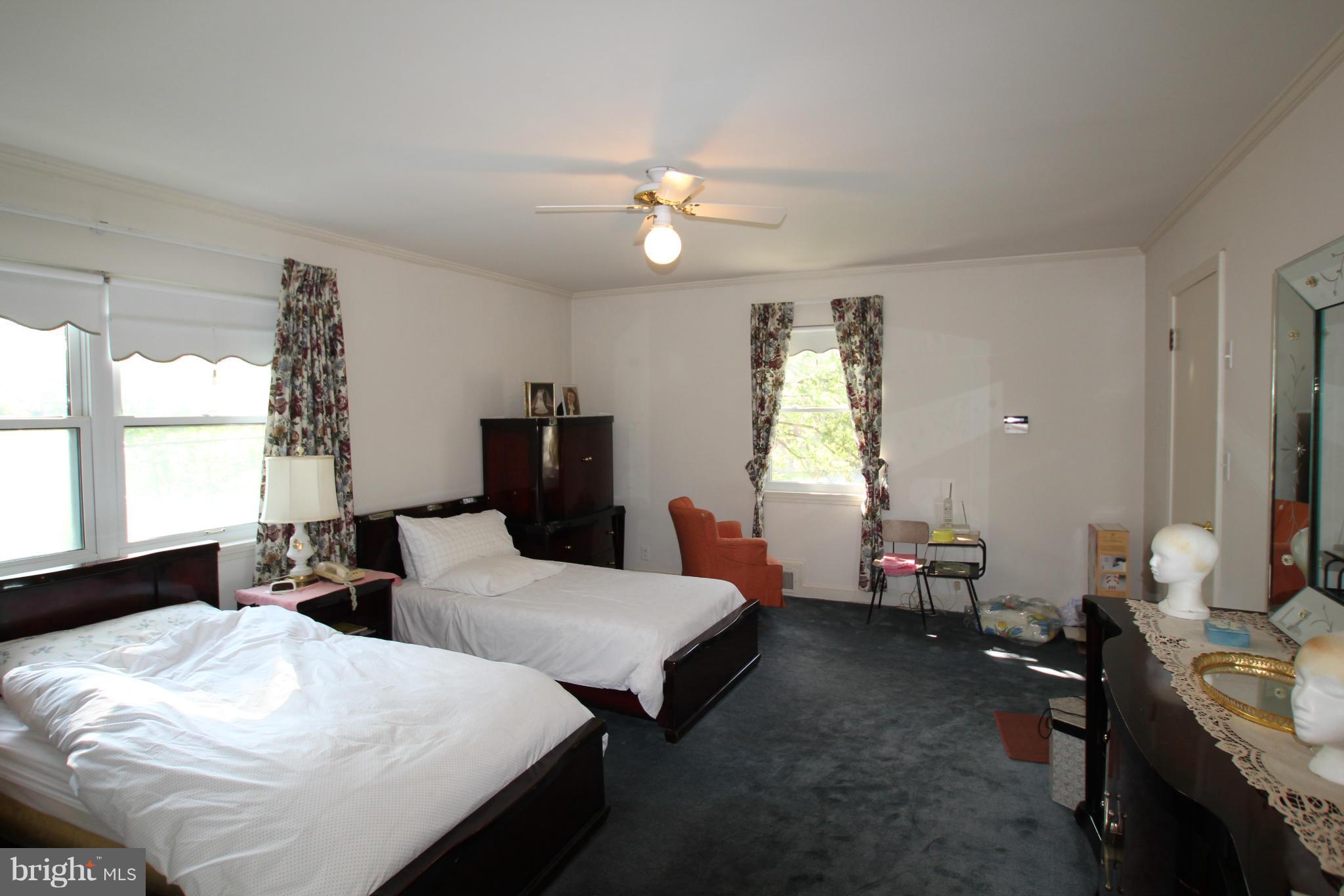 3511 Labyrinth Road Baltimore, MD 21215 - Photo 14 of 20 a bedroom with two beds and a window