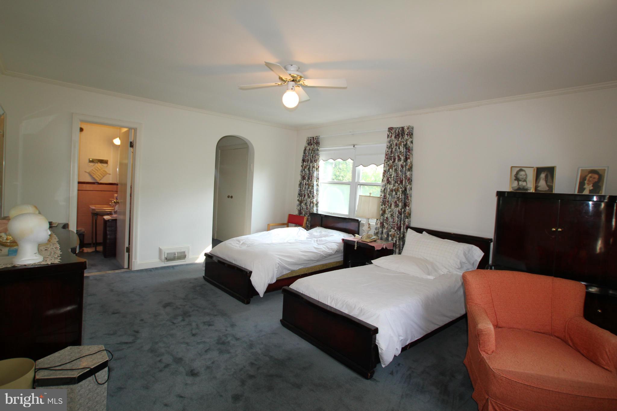 3511 Labyrinth Road Baltimore, MD 21215 - Photo 15 of 20 a bedroom with furniture and a large mirror