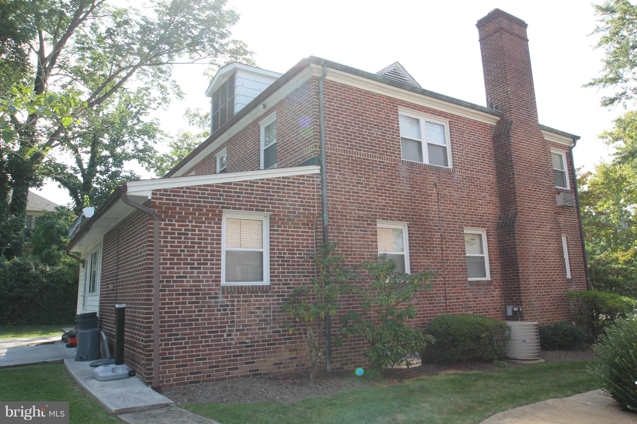 3511 Labyrinth Road Baltimore, MD 21215 - Photo 18 of 20 a front view of a house with garden