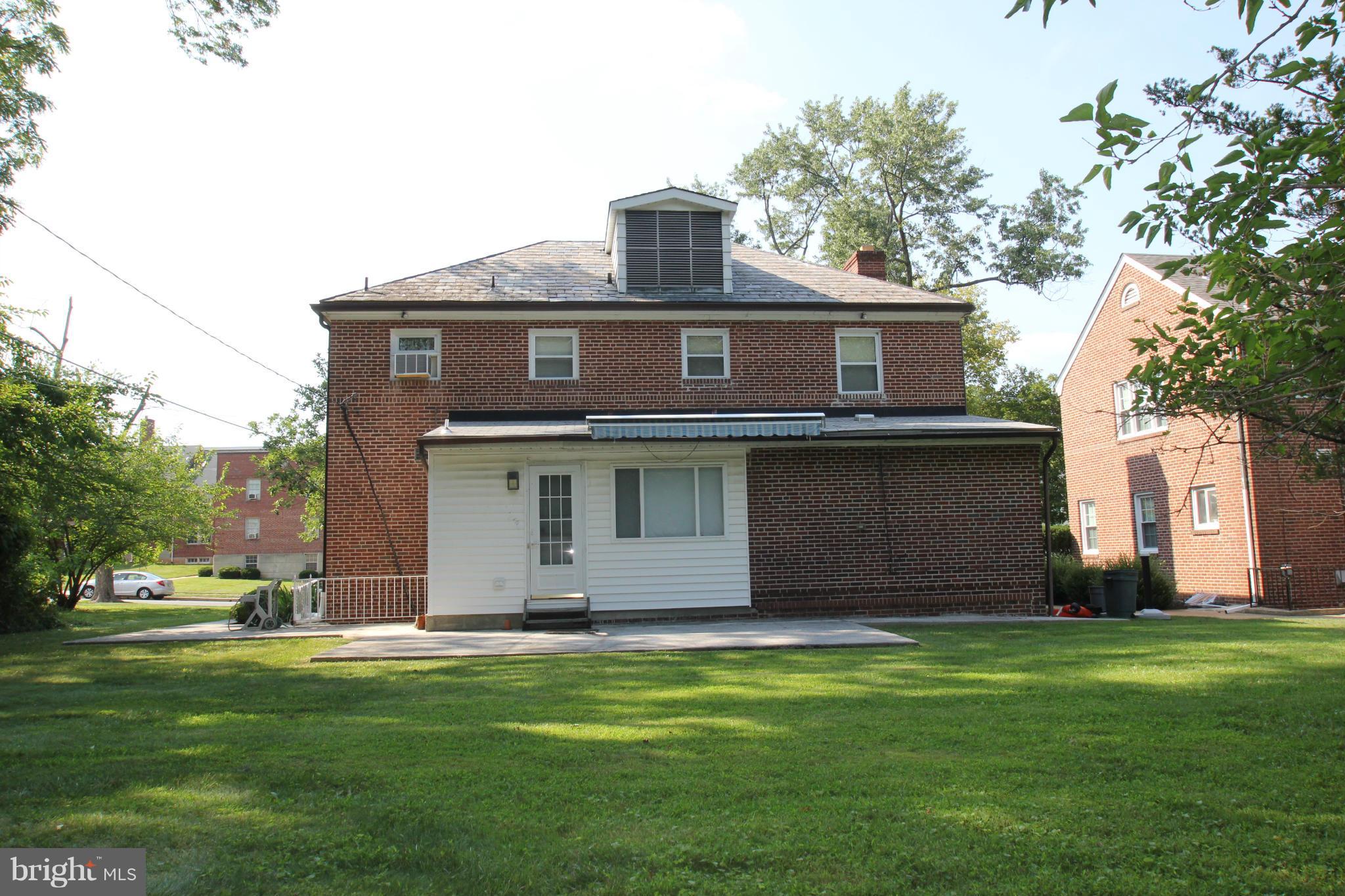 3511 Labyrinth Road Baltimore, MD 21215 - Photo 19 of 20 a front view of a house with a garden