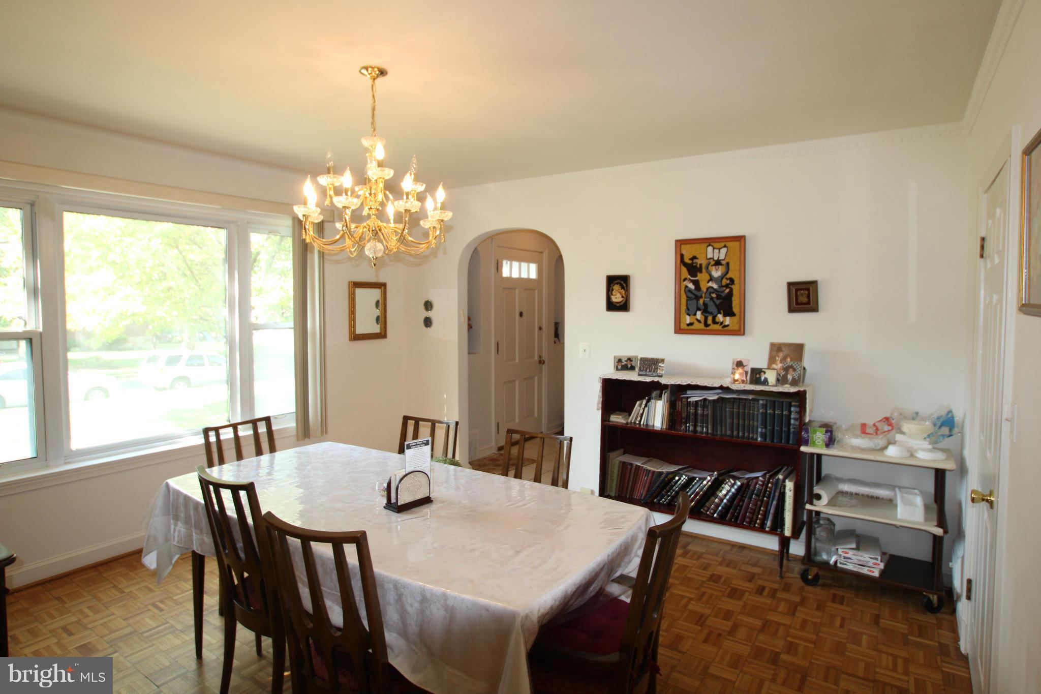 3511 Labyrinth Road Baltimore, MD 21215 - Photo 3 of 20 a view of a dining room with furniture and window