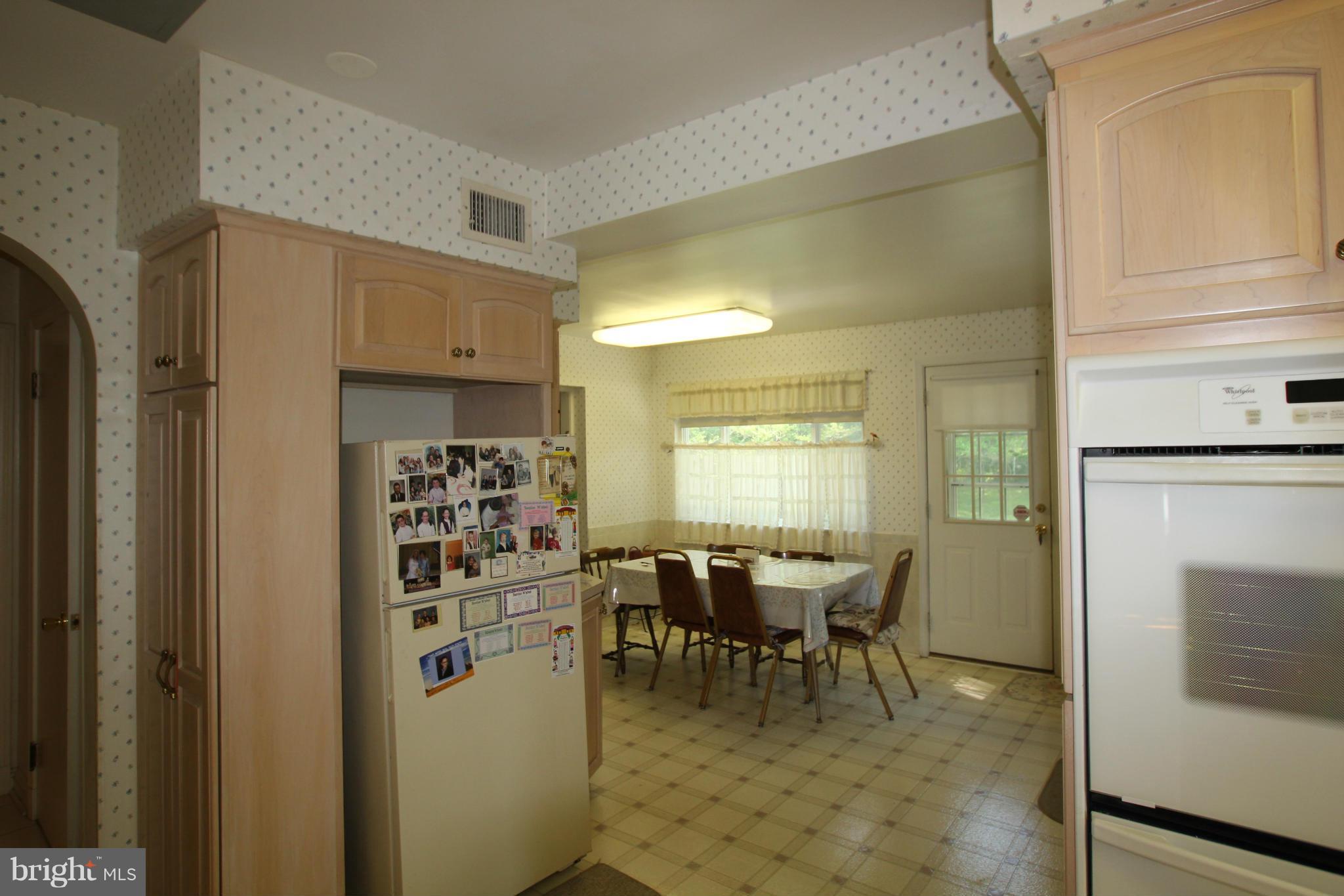3511 Labyrinth Road Baltimore, MD 21215 - Photo 6 of 20 a view of a dining room with furniture