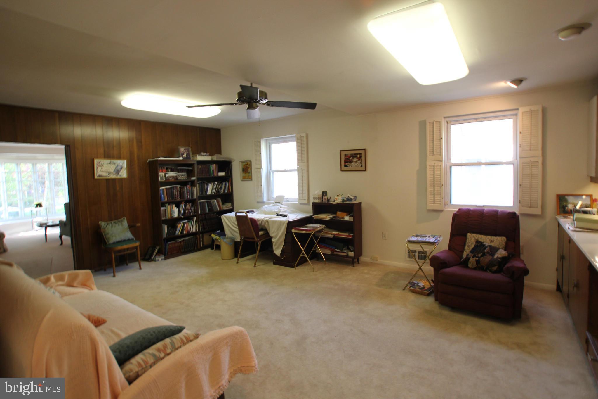 3511 Labyrinth Road Baltimore, MD 21215 - Photo 7 of 20 a living room with furniture ceiling fan and a window