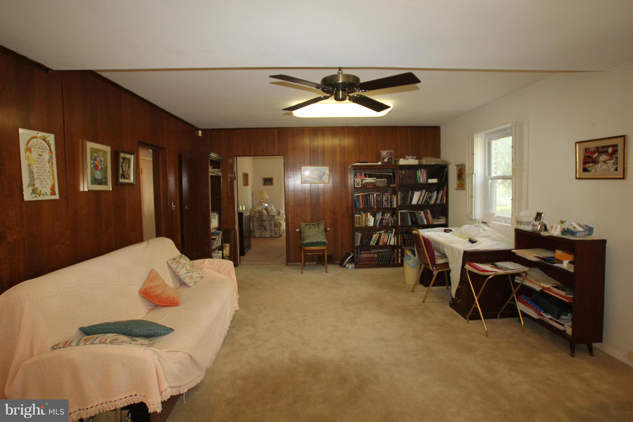 3511 Labyrinth Road Baltimore, MD 21215 - Photo 8 of 20 a living room with furniture and a window