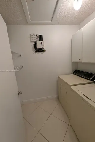 a view of storage and utility room with washer and dryer