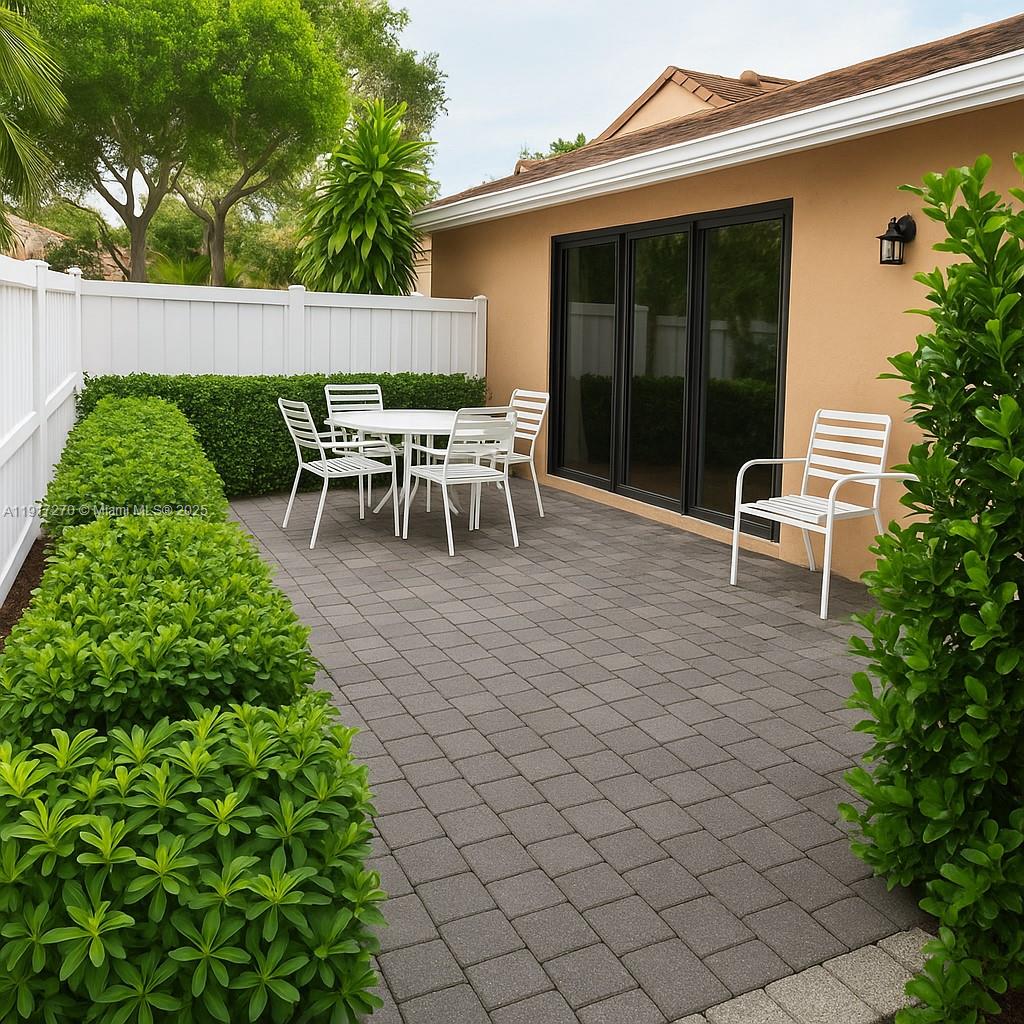 8190 Springtree Road, Unit 8190 Boca Raton, FL 33496 - Photo 22 of 23 a couple of chairs sitting in front of a house