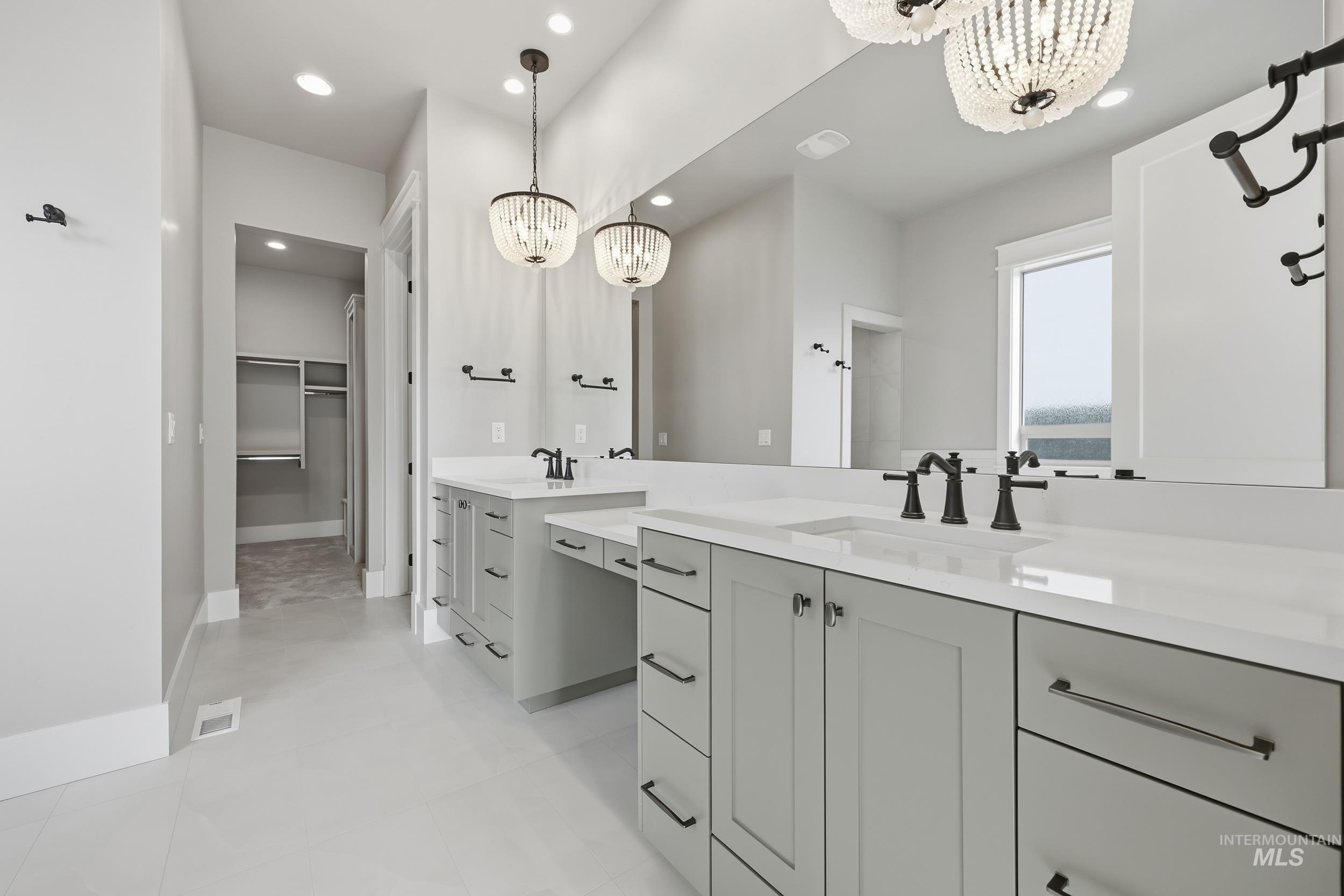1035 East Crescendo Street Meridian, ID 83642 - Photo 24 of 50 Bathroom with vanity, a chandelier, recessed lighting, and a spacious closet