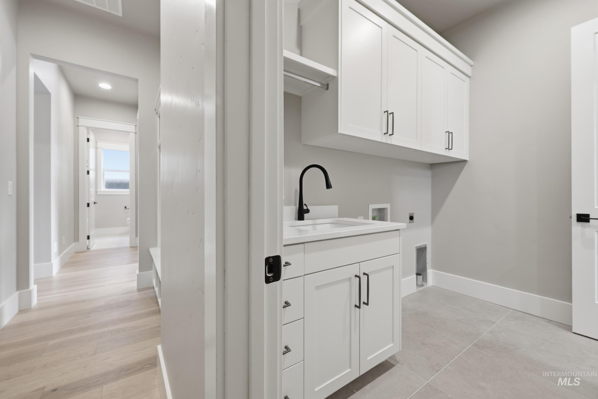 1035 East Crescendo Street Meridian, ID 83642 - Photo 26 of 50 Washroom featuring cabinet space, electric dryer hookup, and hookup for a washing machine