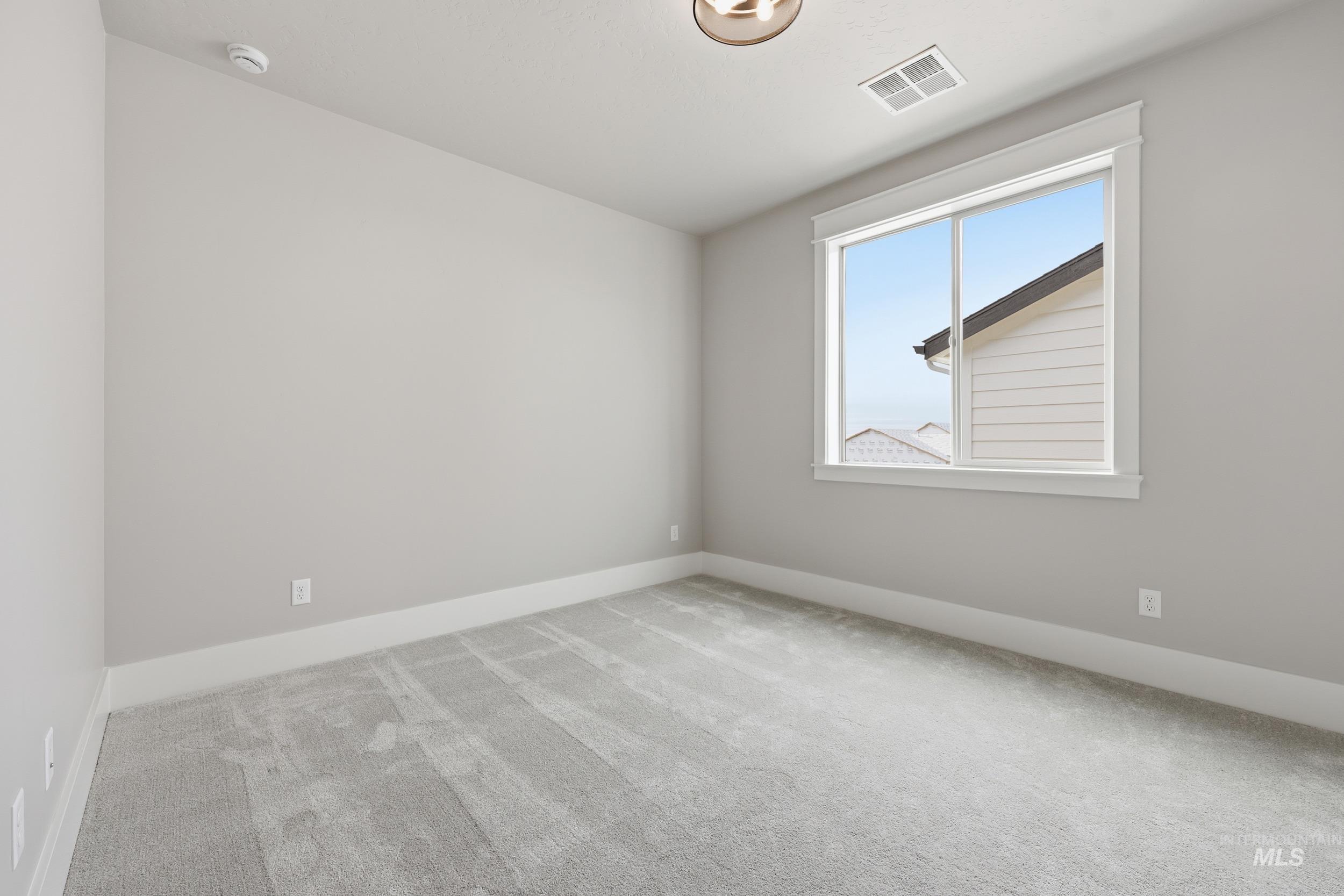 1035 East Crescendo Street Meridian, ID 83642 - Photo 36 of 50 Unfurnished room featuring light colored carpet and baseboards