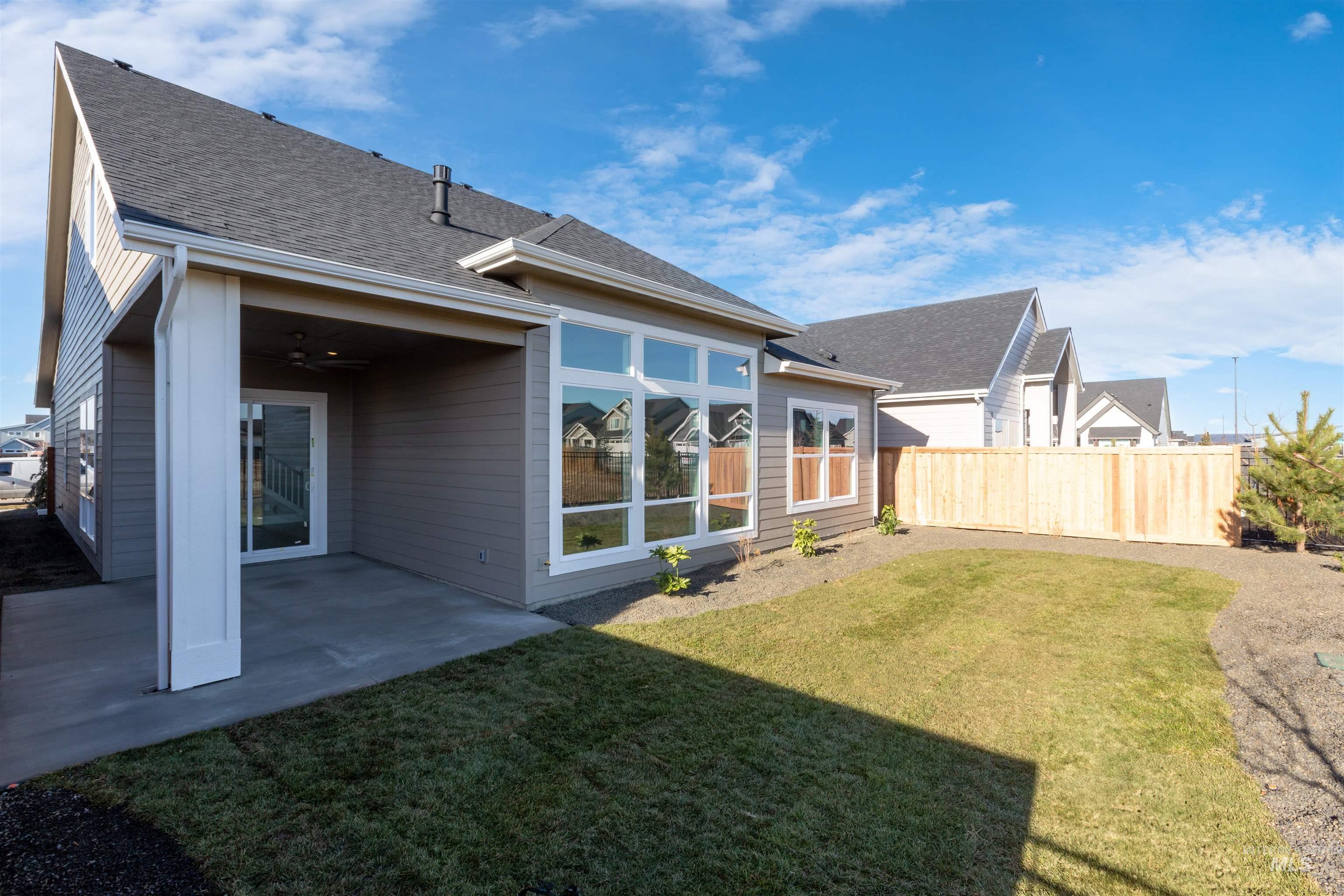 1035 East Crescendo Street Meridian, ID 83642 - Photo 40 of 50 Back of house featuring a patio area and roof with shingles