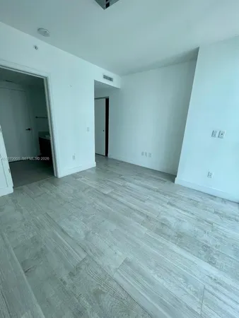 a bathroom with a sink a mirror and a shower