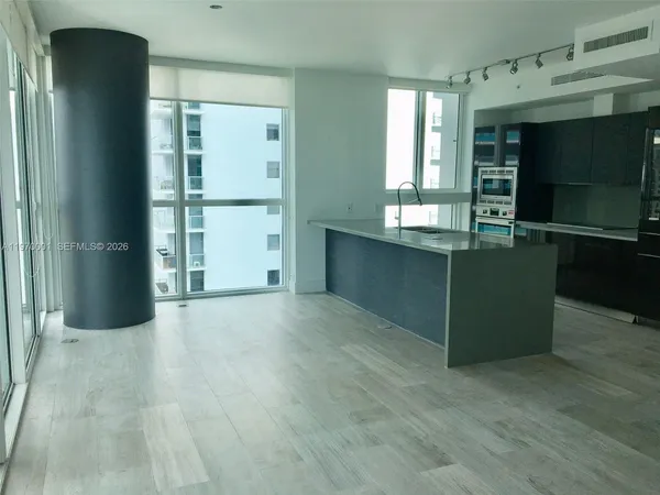 a view of kitchen with furniture and window