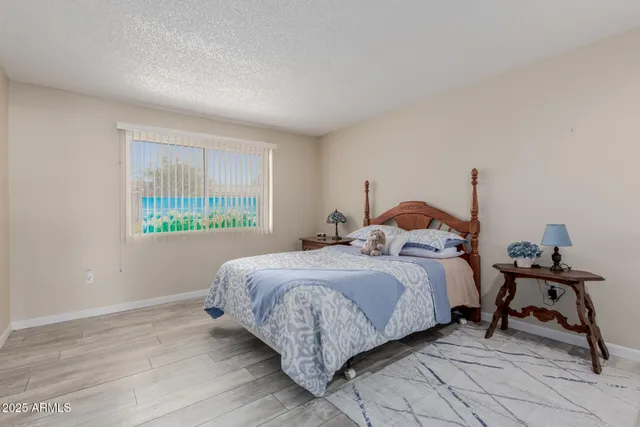 a bedroom with bed and a window