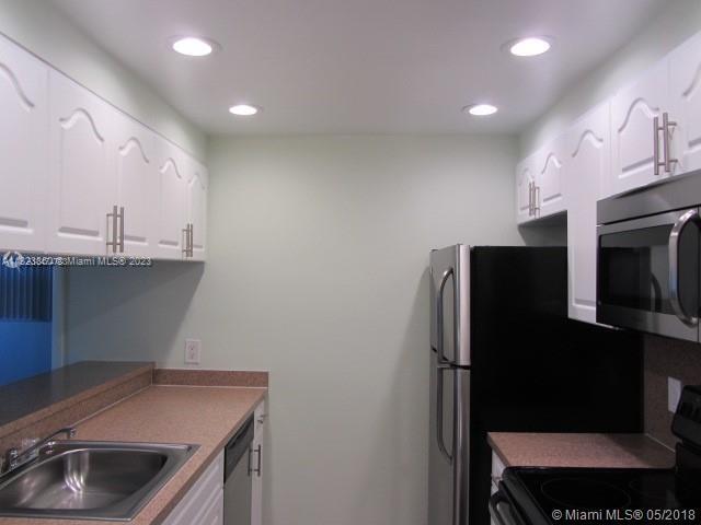 Doral Doral, FL 33166 - Photo 16 of 26 a kitchen with stainless steel appliances a refrigerator and a sink