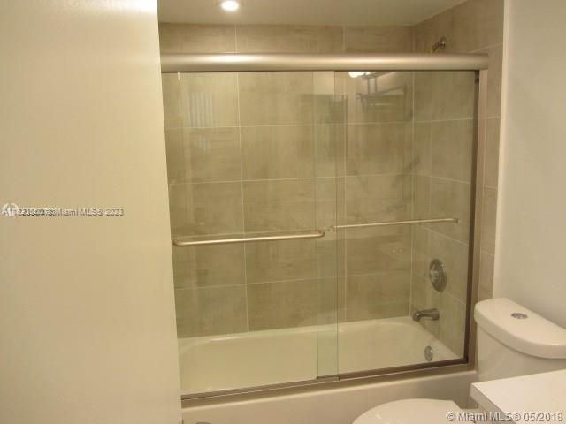 Doral Doral, FL 33166 - Photo 19 of 26 a bathroom with a shower and toilet