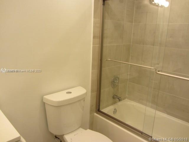 Doral Doral, FL 33166 - Photo 24 of 26 a bathroom with a toilet and shower