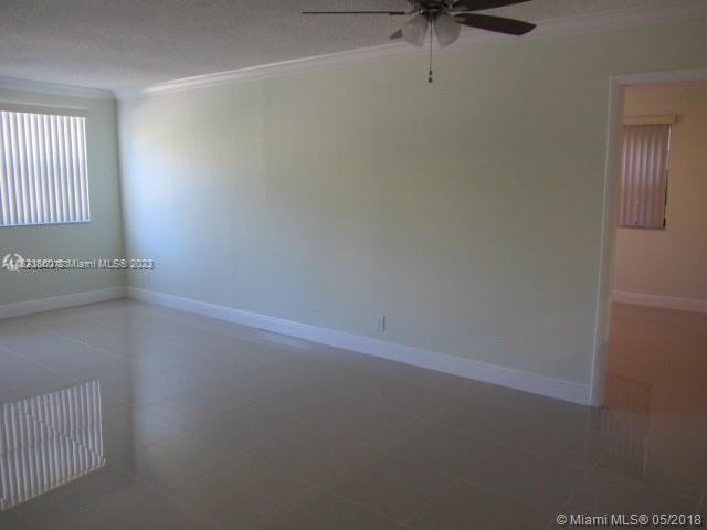 Doral Doral, FL 33166 - Photo 25 of 26 an empty room with a window and a fan