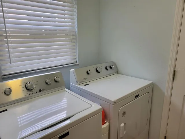 a utility room with dryer and washer