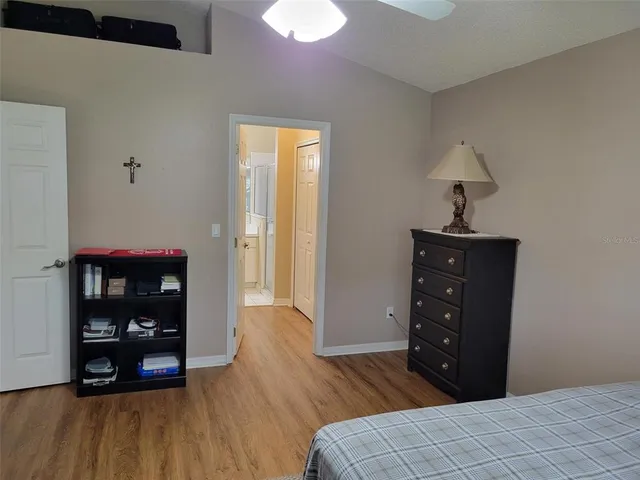 a bedroom with a bed and a table