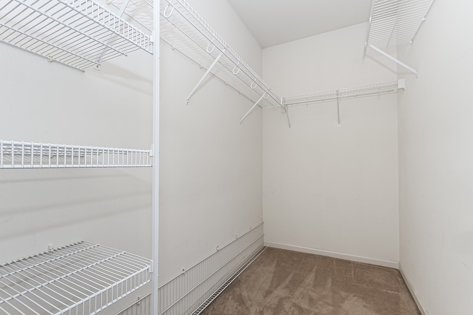 112 Durango Drive Gilberts, IL 60136 - Photo 14 of 24 a view of a room with racks on the wall