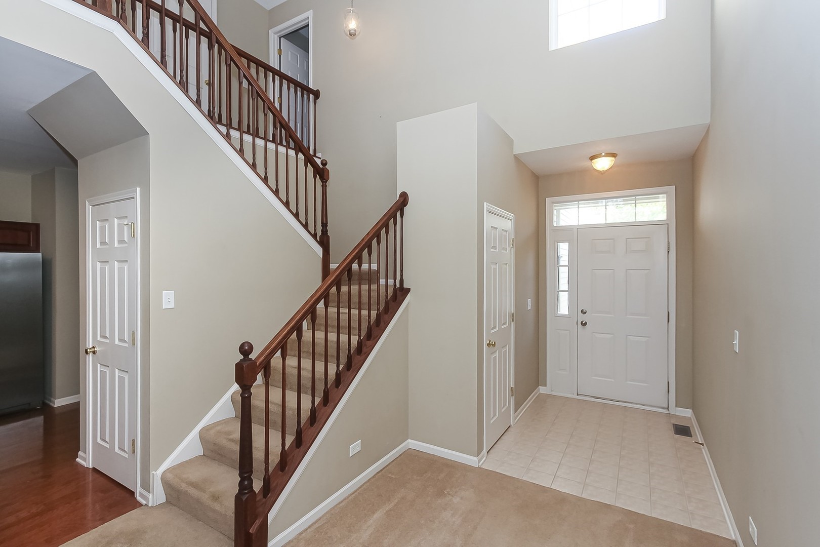 112 Durango Drive Gilberts, IL 60136 - Photo 2 of 24 a view of staircase with wooden floor and entryway
