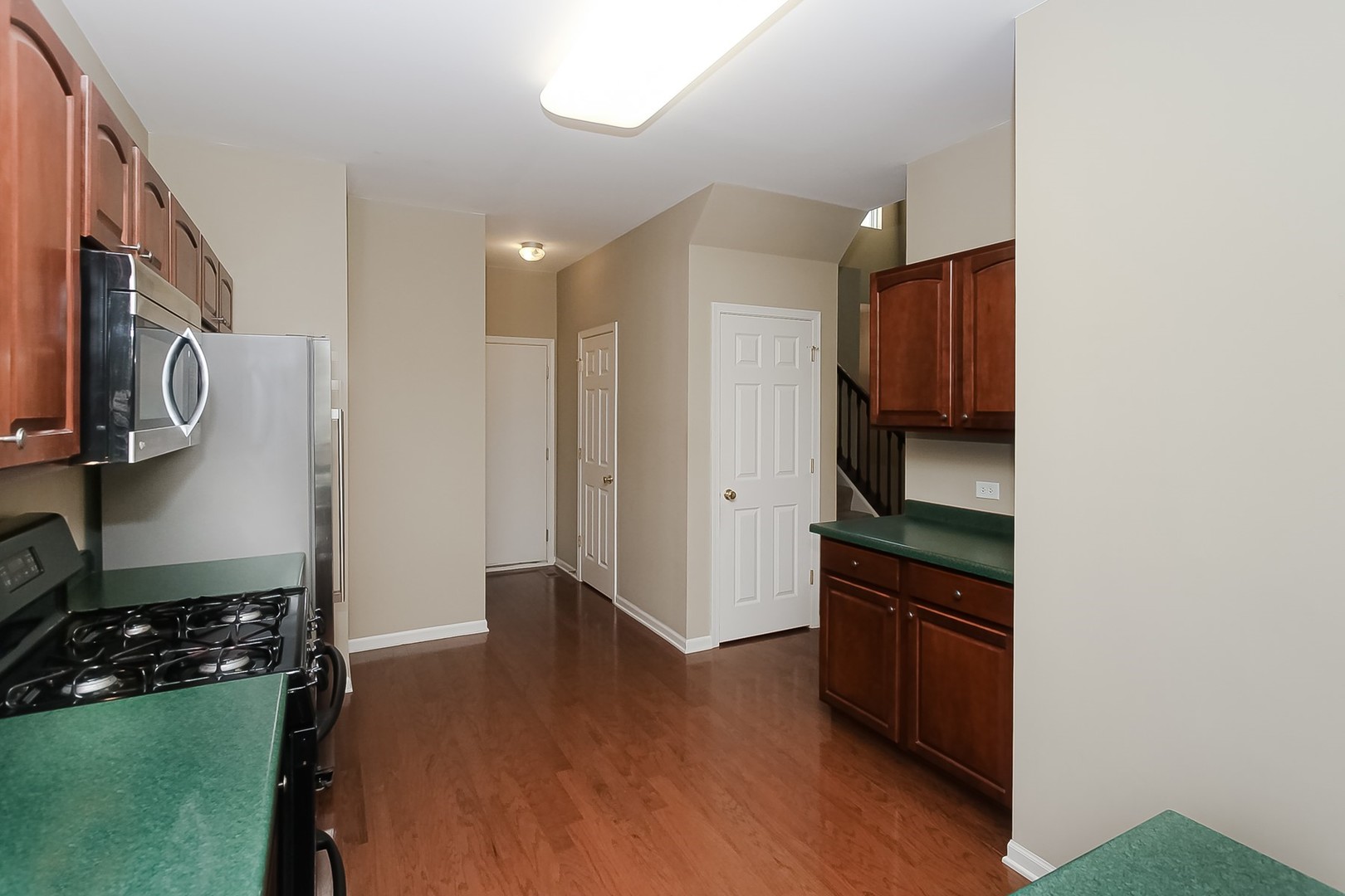 112 Durango Drive Gilberts, IL 60136 - Photo 9 of 24 a kitchen with stainless steel appliances granite countertop a refrigerator and a stove top oven