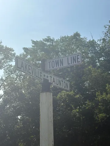 a view of a street with a building in the background