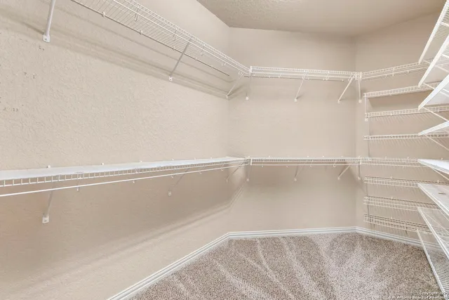 a view of a room with racks on the wall