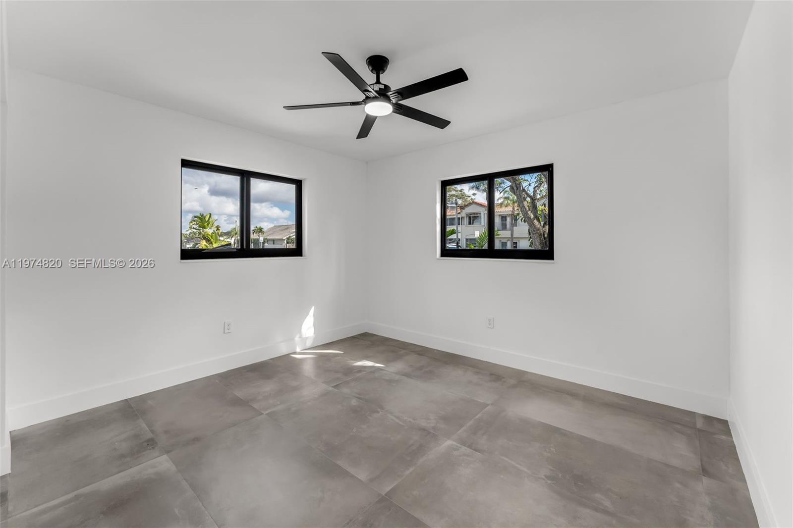 7120 Southwest 92nd Avenue Miami, FL 33173 - Photo 15 of 48 an empty room with window and ceiling fan