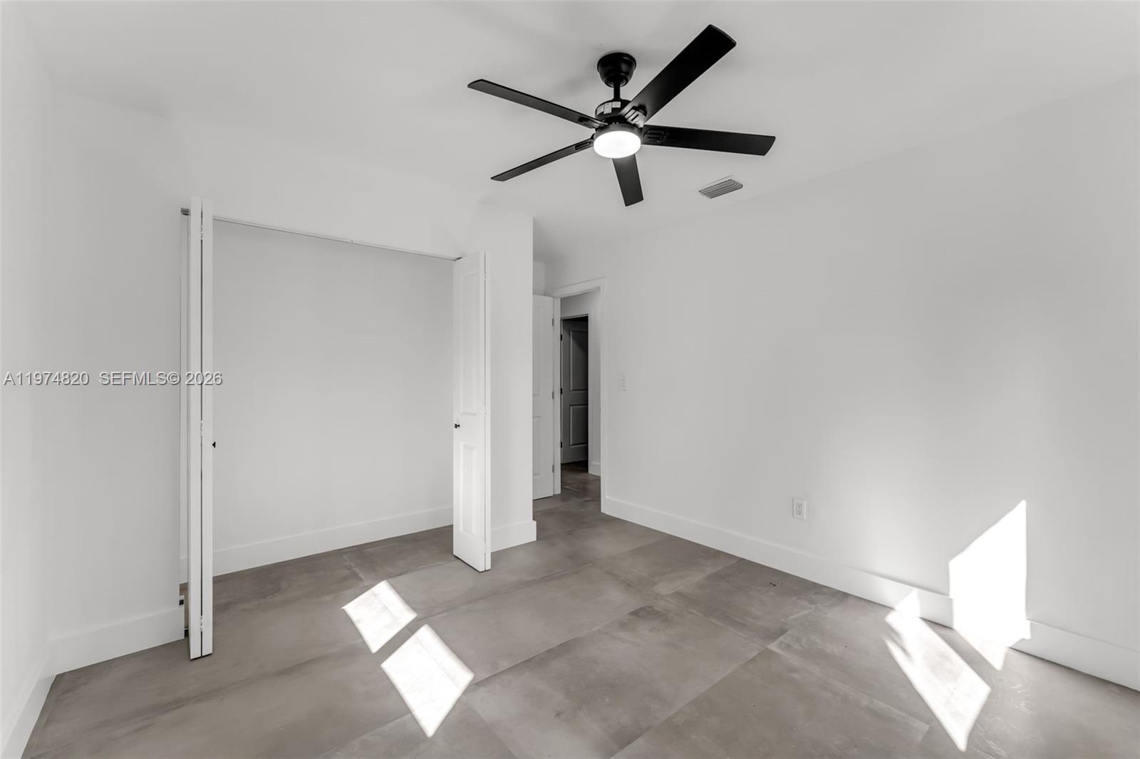 7120 Southwest 92nd Avenue Miami, FL 33173 - Photo 16 of 48 a view of a livingroom with a ceiling fan and window