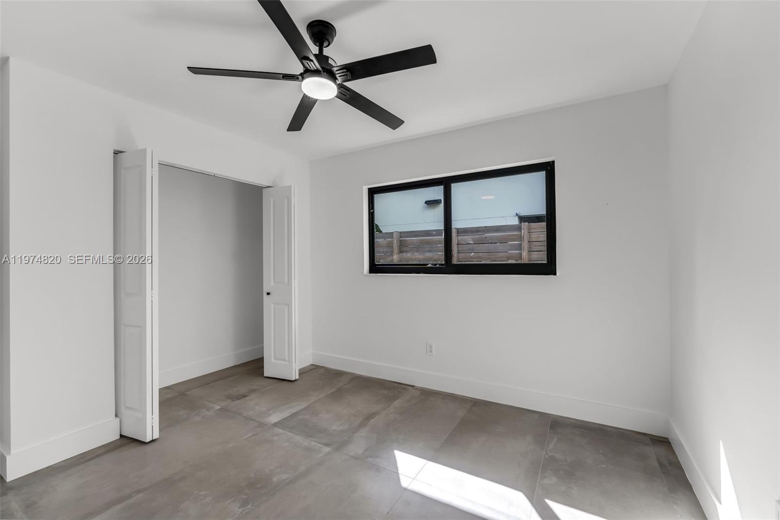 7120 Southwest 92nd Avenue Miami, FL 33173 - Photo 19 of 48 a view of a hallway with a ceiling fan