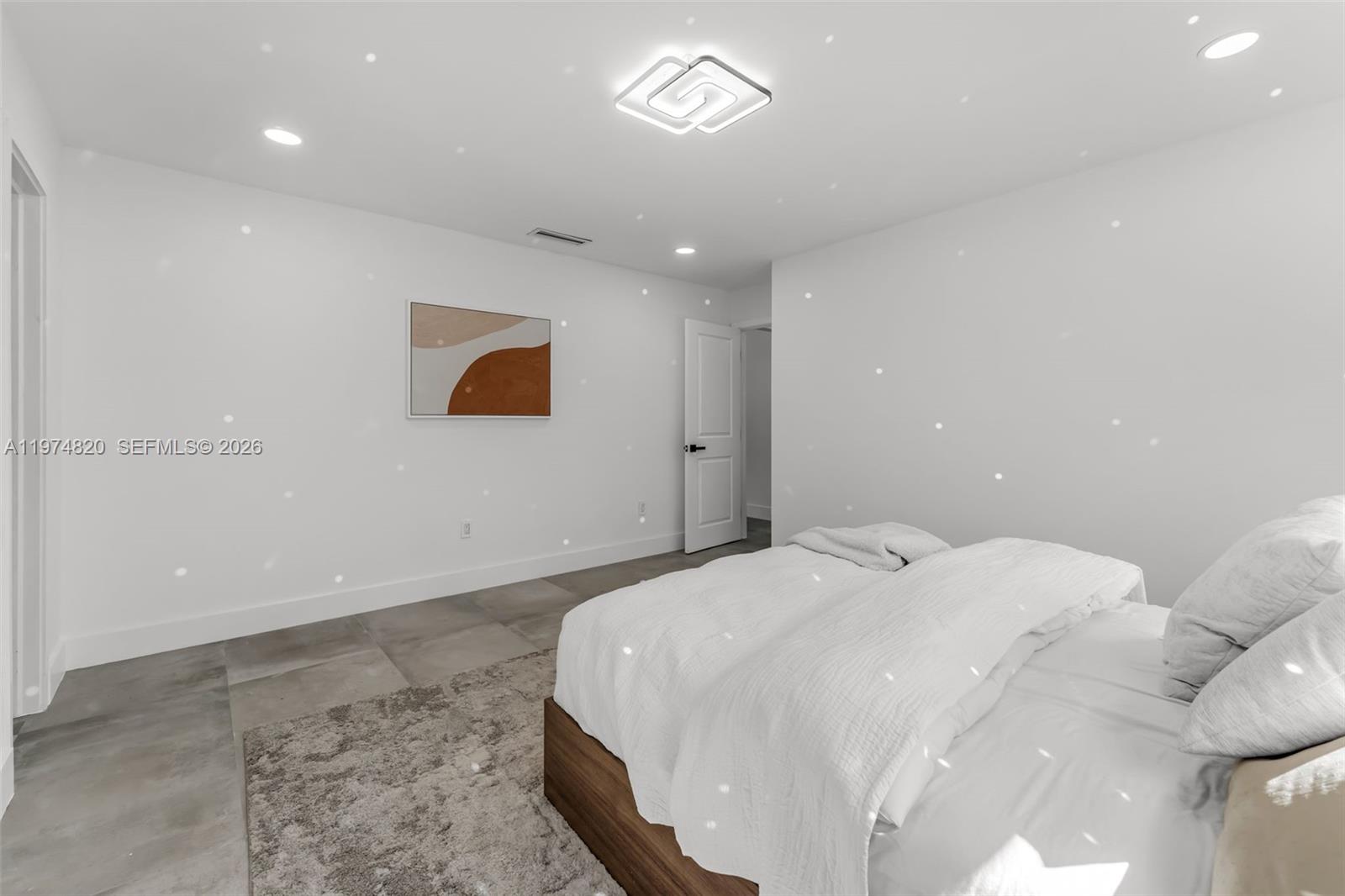 7120 Southwest 92nd Avenue Miami, FL 33173 - Photo 24 of 48 a bedroom with a bed and a painting