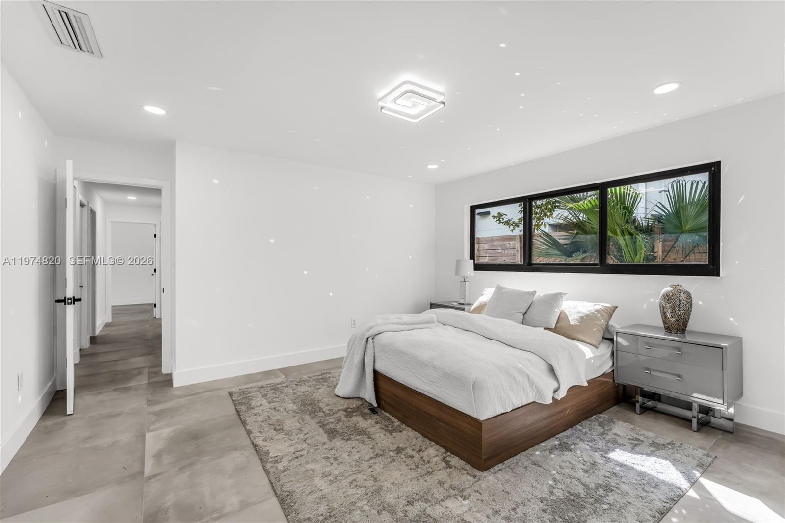 7120 Southwest 92nd Avenue Miami, FL 33173 - Photo 26 of 48 a bedroom with a bed and a flat screen tv