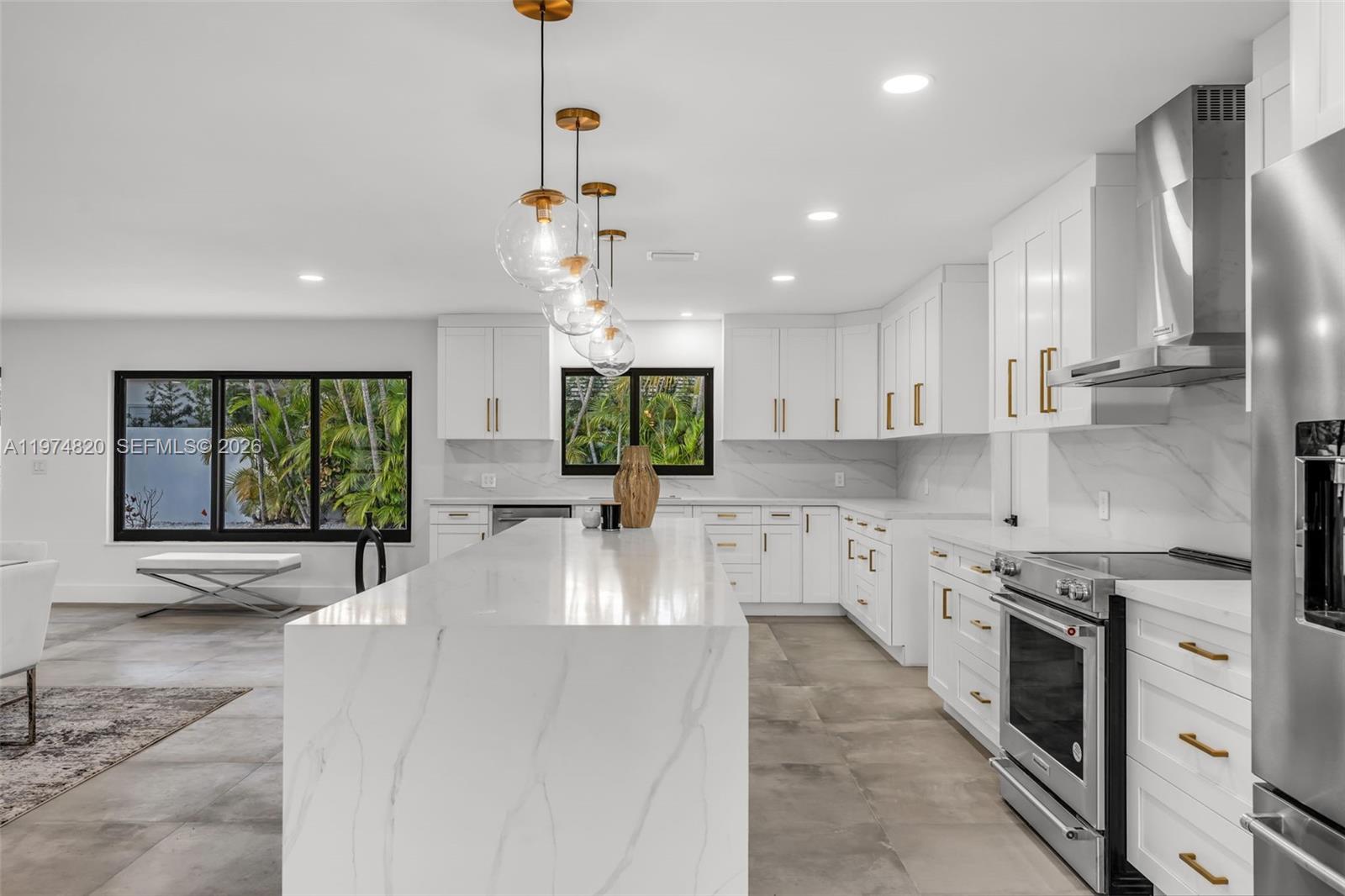 7120 Southwest 92nd Avenue Miami, FL 33173 - Photo 30 of 48 a large kitchen with stainless steel appliances lots of counter space and a sink