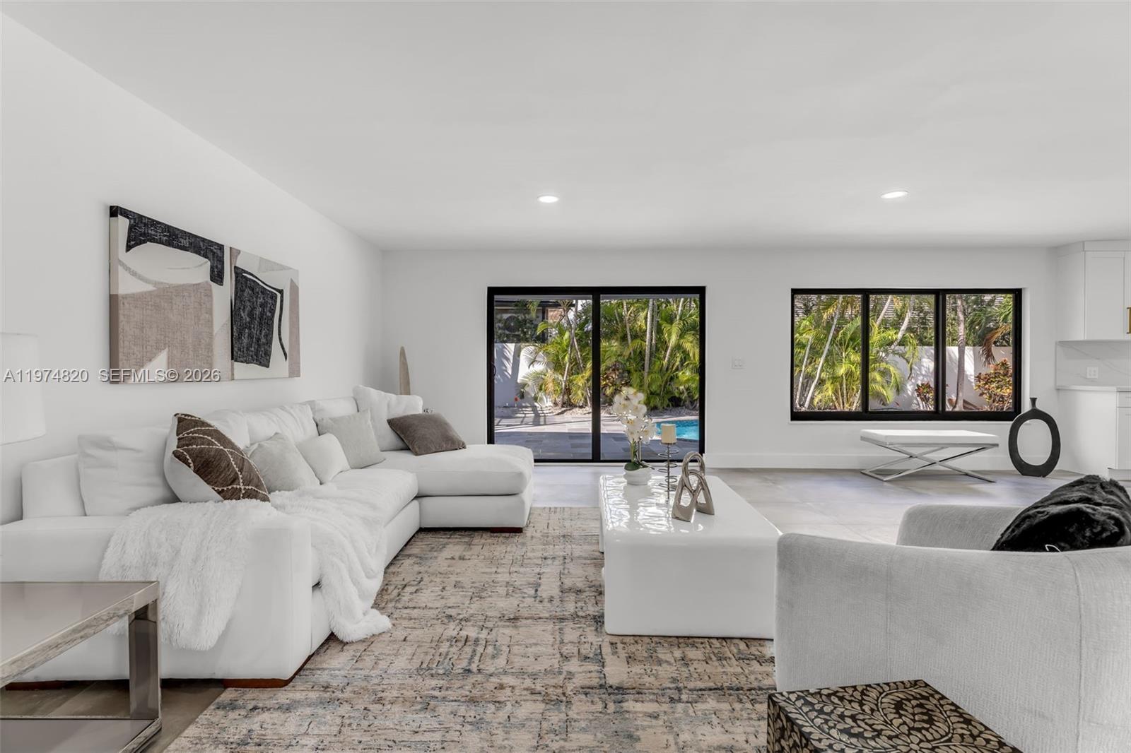 7120 Southwest 92nd Avenue Miami, FL 33173 - Photo 32 of 48 a living room with furniture and a large window