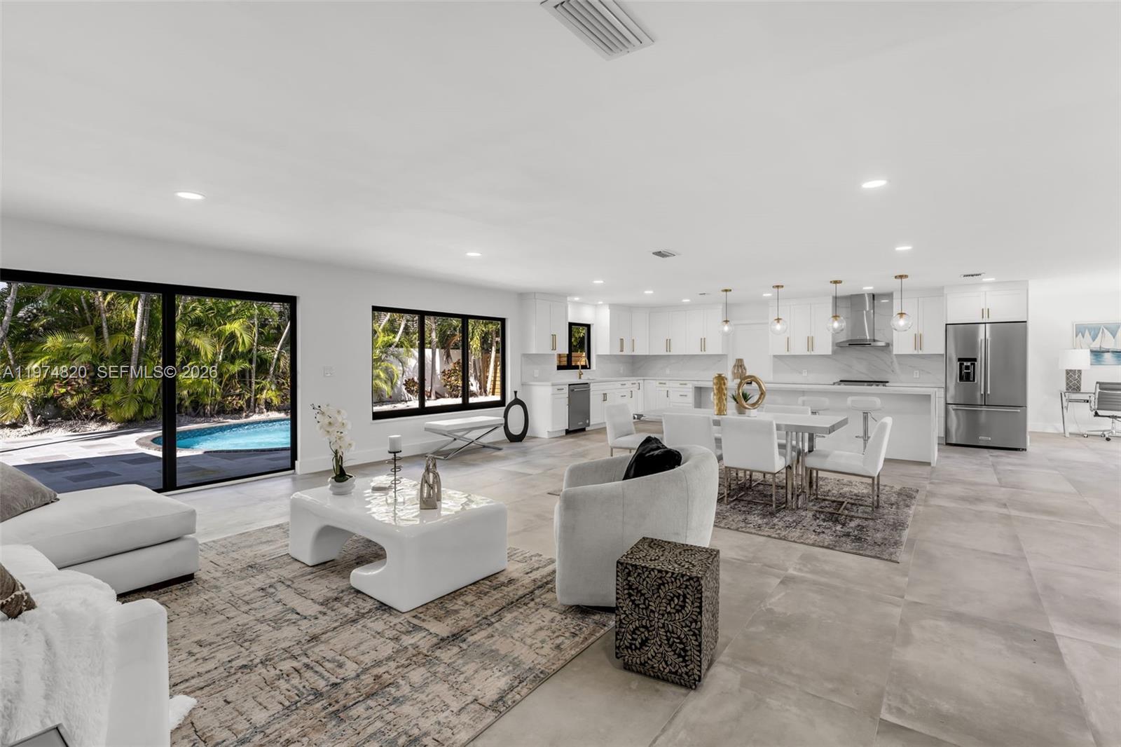 7120 Southwest 92nd Avenue Miami, FL 33173 - Photo 33 of 48 a living room with furniture and a large window