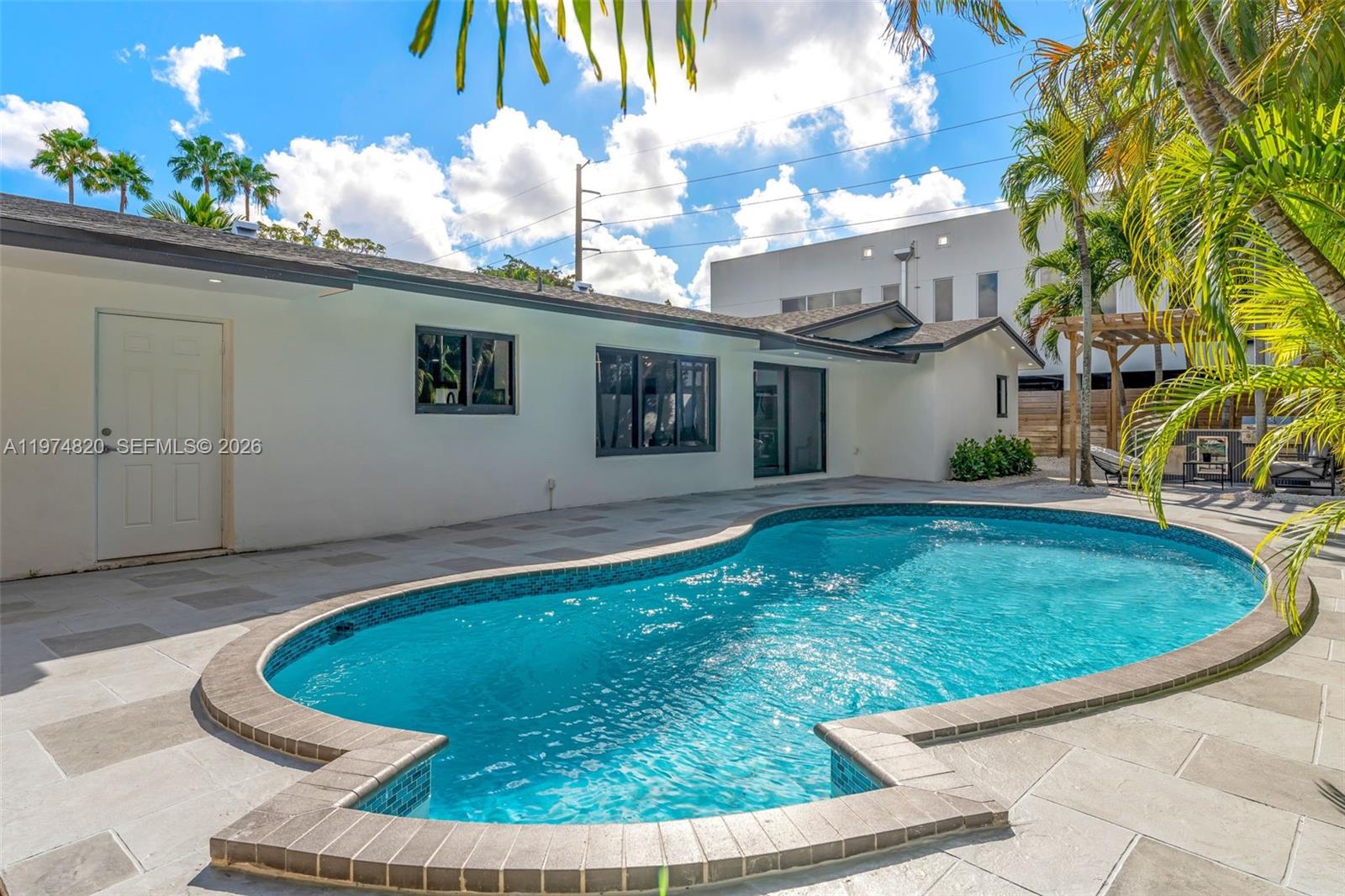 7120 Southwest 92nd Avenue Miami, FL 33173 - Photo 8 of 48 a view of a house with roof deck and sitting area
