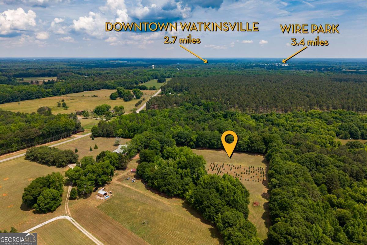 6.04-acres Old Bishop Road Bishop, GA 30621 - Photo 2 of 30 a view of a water with huge green field and large trees